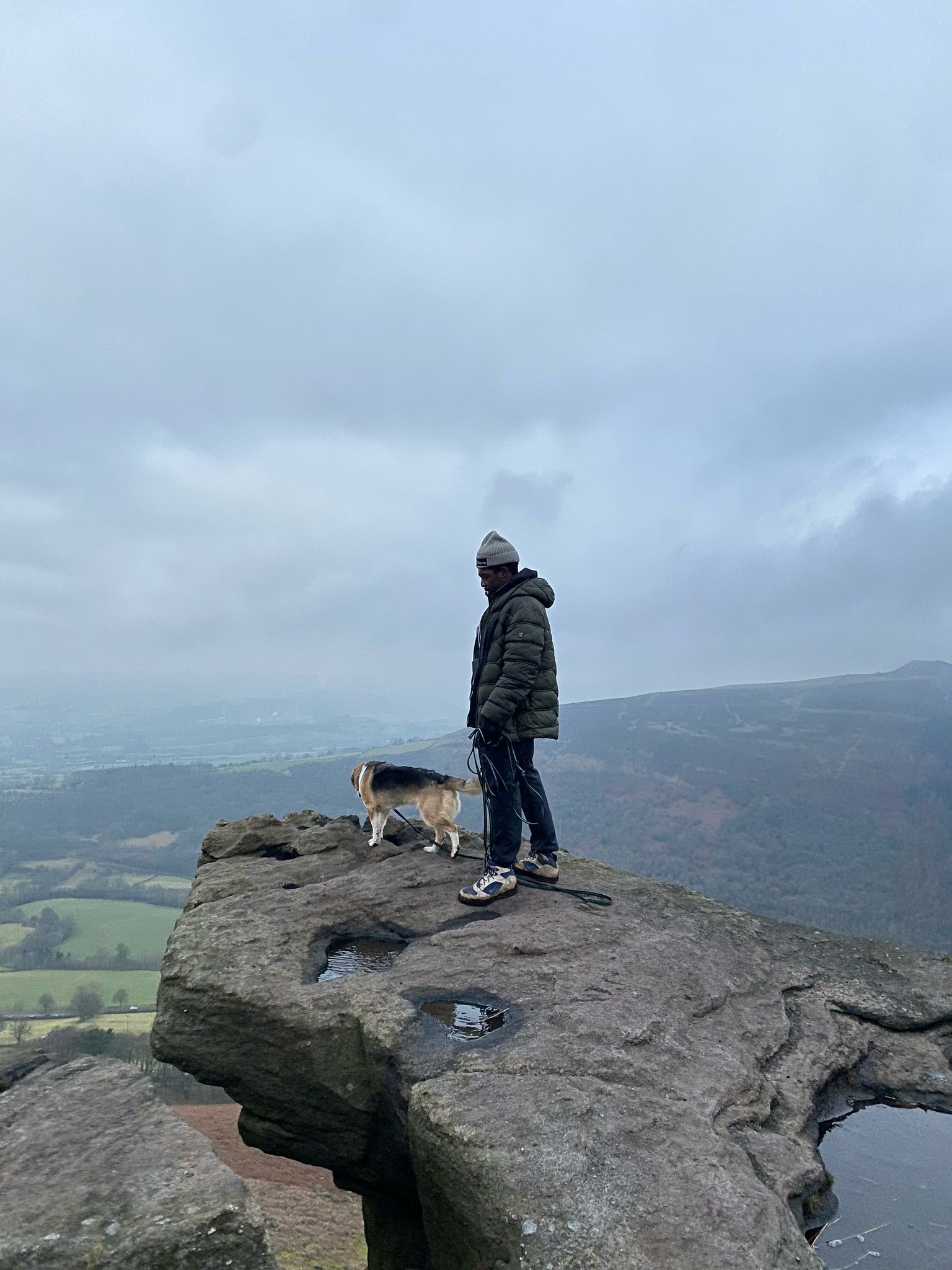Oggy with his dog on a hill overlooking the Huddersfield landscape